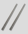 Two PureTi titanium chopsticks on a light gray background