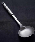 PureTi titanium solid spoon on a black fabric background