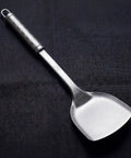 PureTi titanium solid turner on a black fabric background