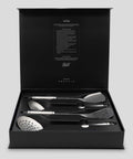 Set of PureTi titanium utensils in a black box on a light gray background